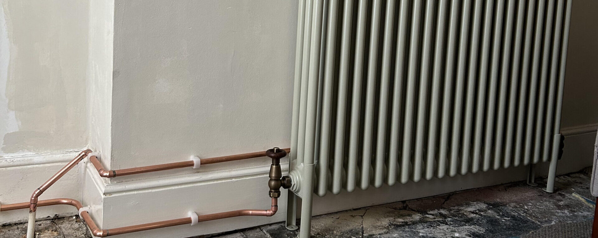 White column radiator installation in Finsbury Park